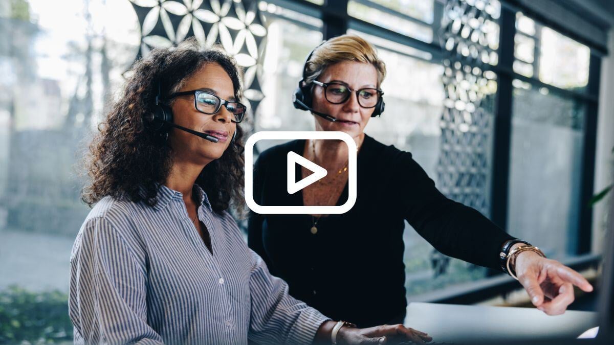 two women looking at screen
